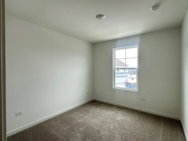 a bathroom with a toilet a sink a mirror and a bathtub