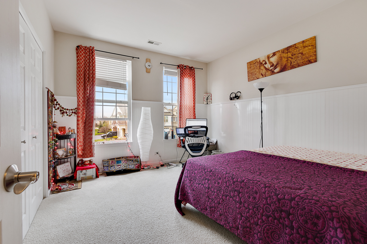 1358 Scarboro Road, Unit 806 Schaumburg, IL 60193 - Photo 11 of 16 a spacious bedroom with a bed and a window