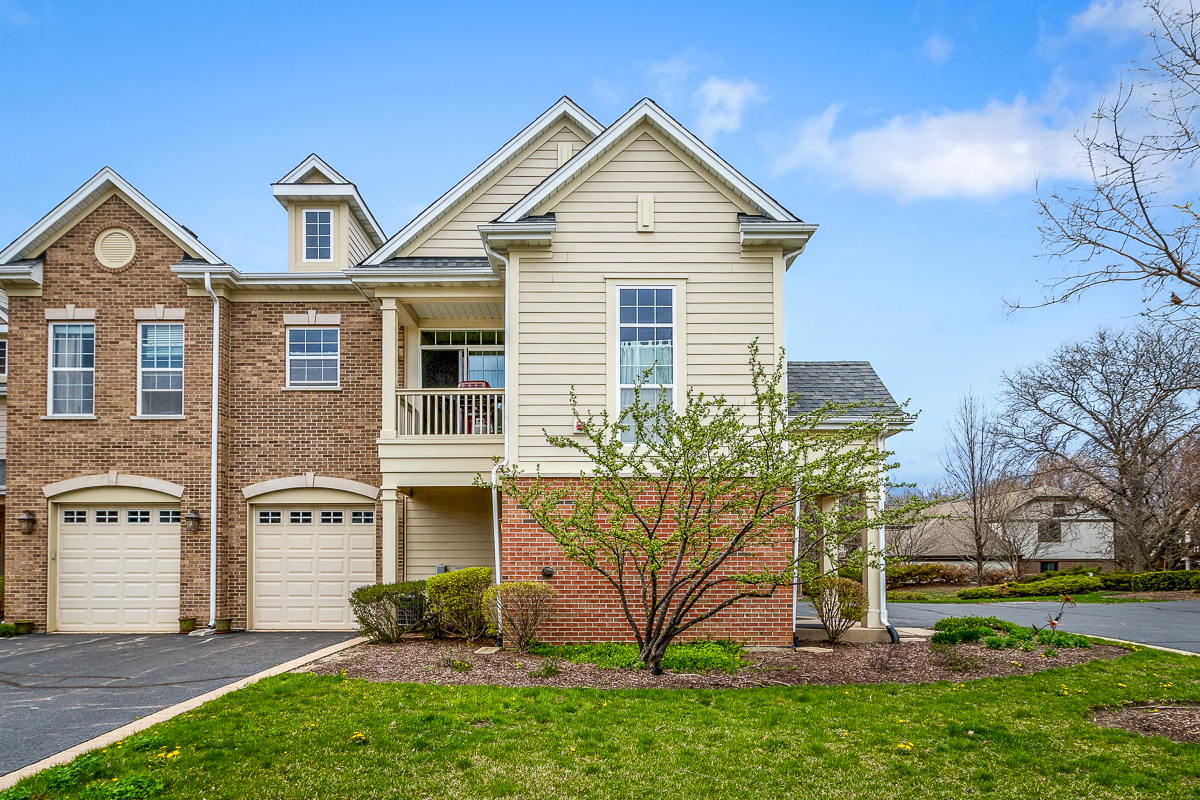 1358 Scarboro Road, Unit 806 Schaumburg, IL 60193 - Photo 16 of 16 a front view of a house with garden