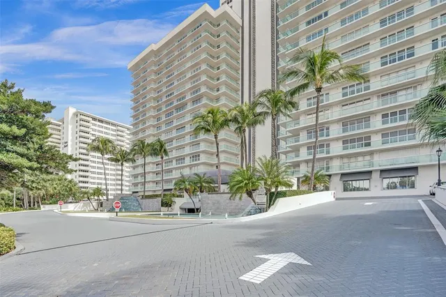 a lobby with furniture and a large window