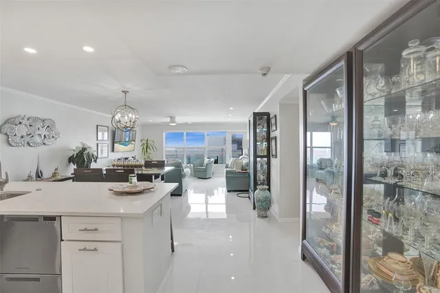 a view of a kitchen center island and stainless steel appliances
