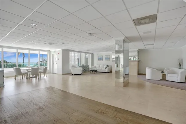 a view of a room with furniture and window