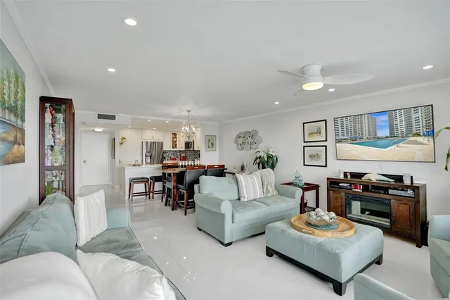 a kitchen with stainless steel appliances white cabinets and a stove top oven