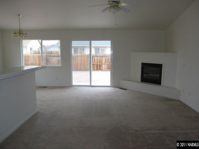 1600 Burger Road Fernley, NV 89408 - Photo 2 of 13 an empty room with a empty space and windows