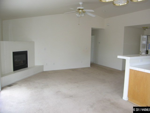 1600 Burger Road Fernley, NV 89408 - Photo 3 of 13 a view of an empty room with a fireplace