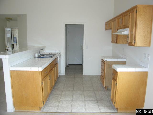 1600 Burger Road Fernley, NV 89408 - Photo 4 of 13 a bathroom with a sink a mirror and a bathtub