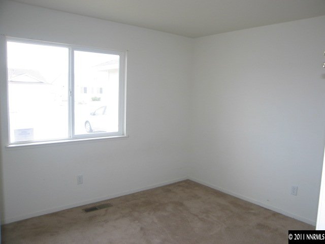 1600 Burger Road Fernley, NV 89408 - Photo 5 of 13 an empty room with a window