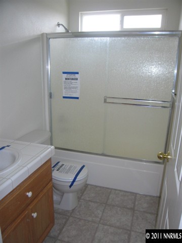 1600 Burger Road Fernley, NV 89408 - Photo 7 of 13 a bathroom with a sink and mirror