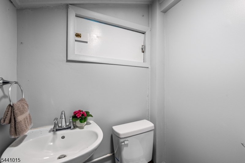 308 Lakeside Avenue Hopatcong, NJ 07821 - Photo 11 of 13 a bathroom with a sink mirror and toilet