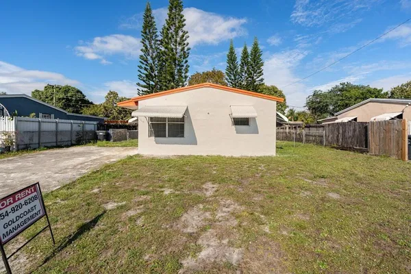 a house with trees in the background