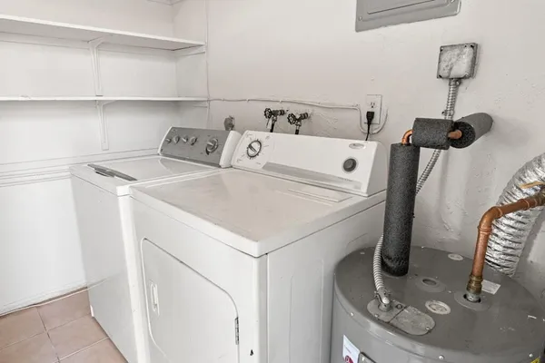 a kitchen with cabinets appliances and a sink