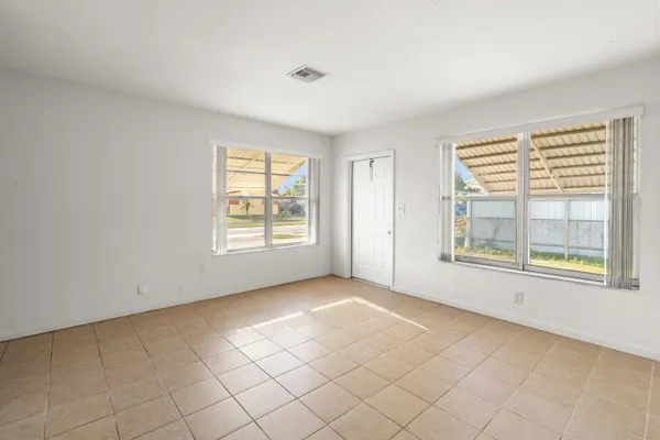 a kitchen with a sink cabinets and window