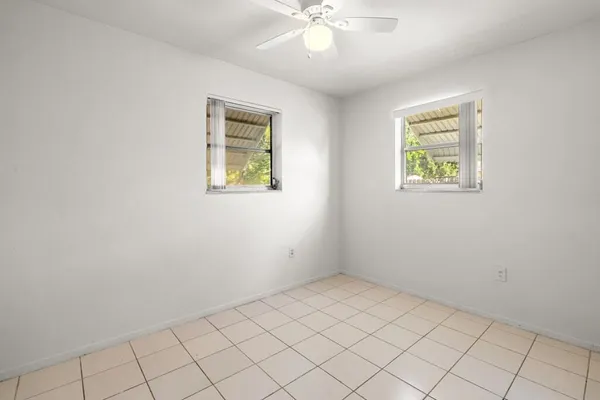 an empty room with fan