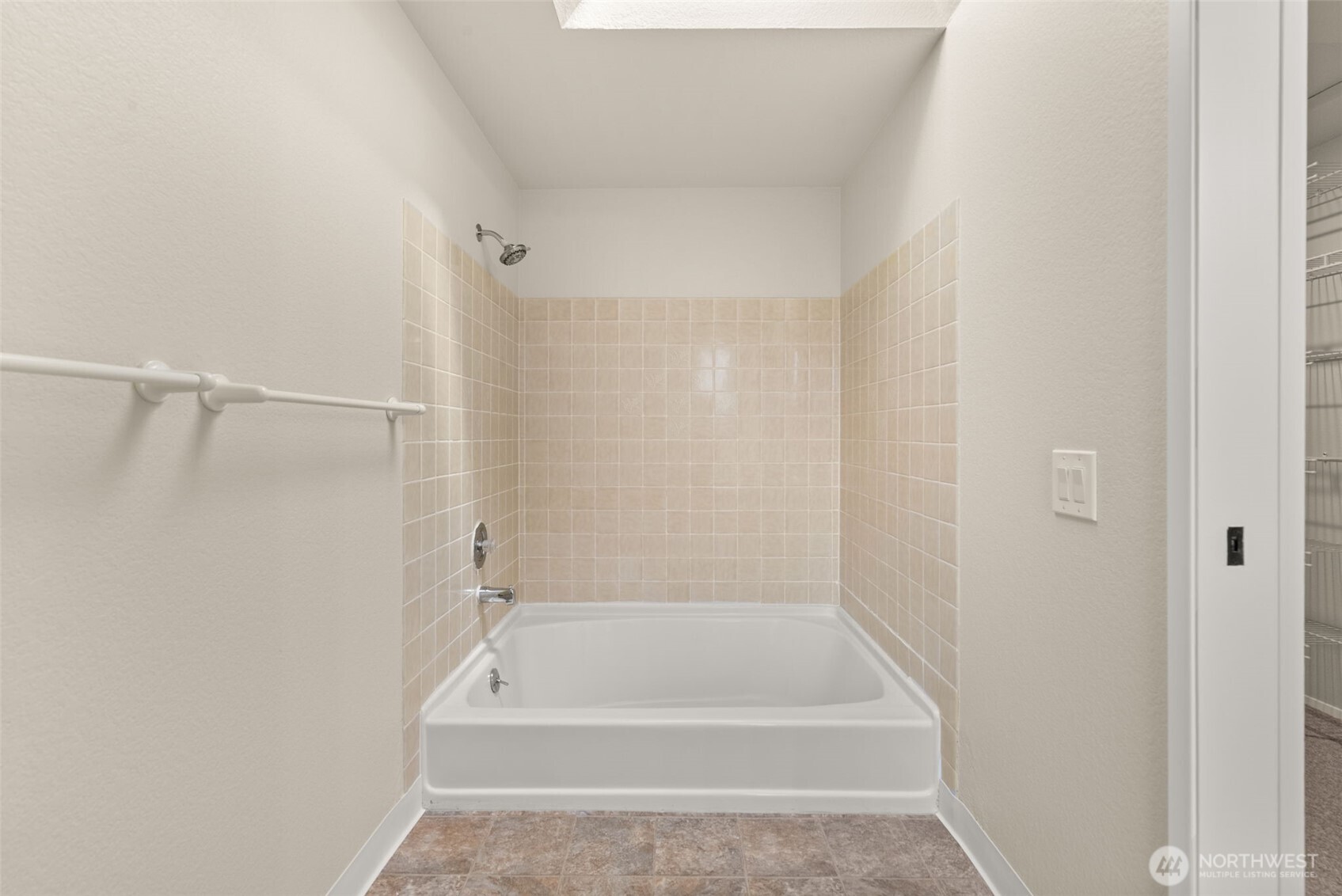 13603 Southeast 239th Street Kent, WA 98042 - Photo 12 of 23 a bathroom with a tub and shower