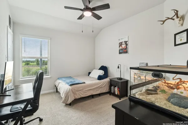 a bedroom with furniture and a window