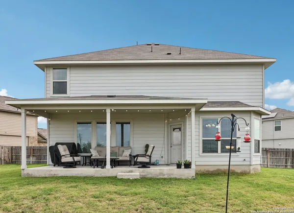 a view of a house with outdoor seating area