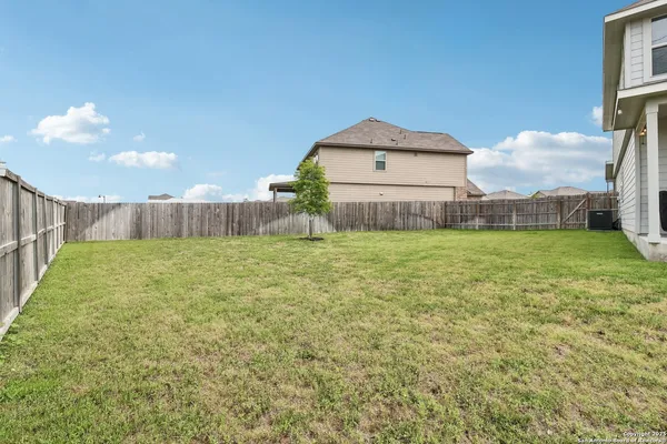 a view of a back yard of the house