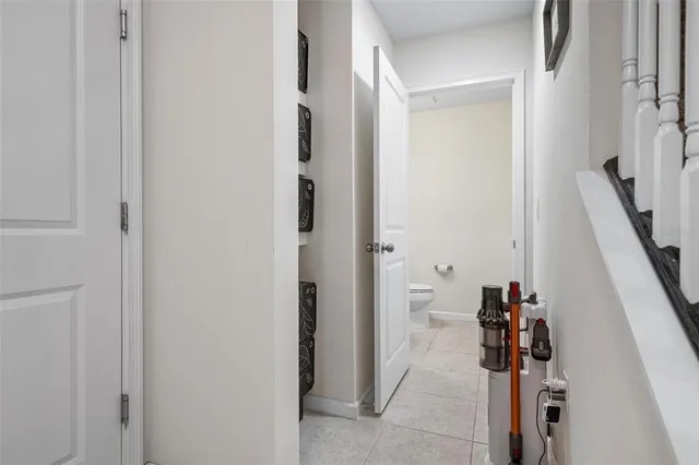 a view of hallway with stairs and closet