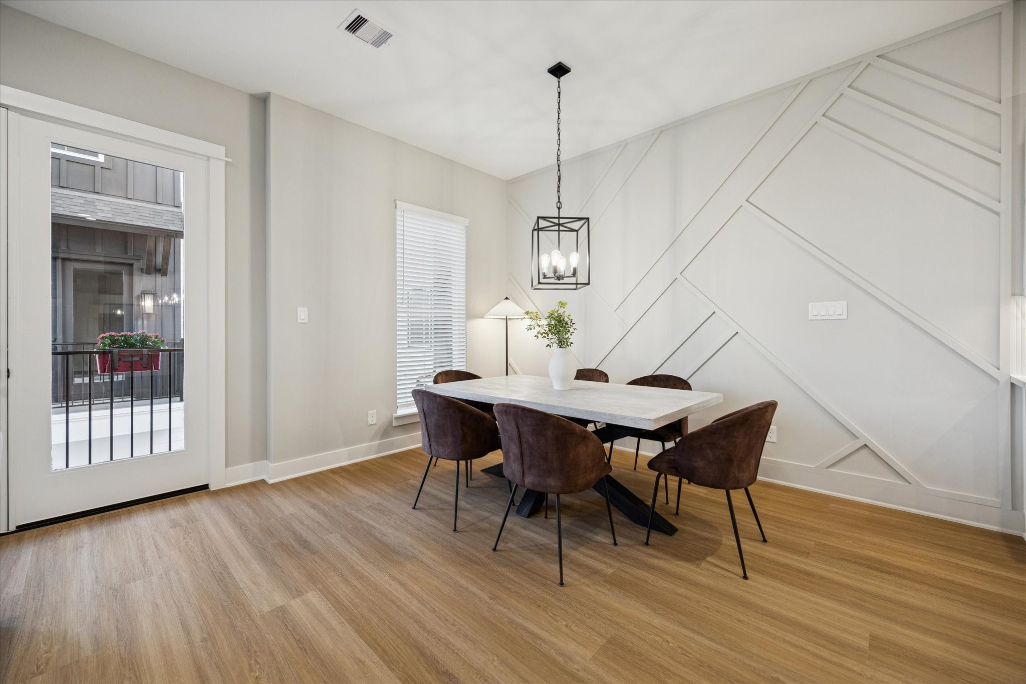 719 Thornton Road, Unit C Houston, TX 77018 - Photo 12 of 45 a view of a dining room with furniture window and wooden floor