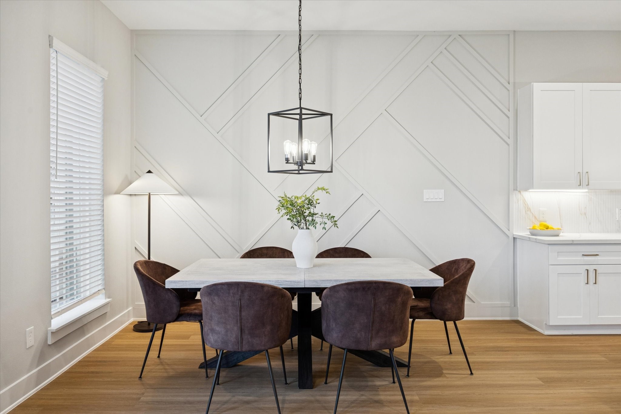 719 Thornton Road, Unit C Houston, TX 77018 - Photo 14 of 45 a view of a dining room with furniture and wooden floor