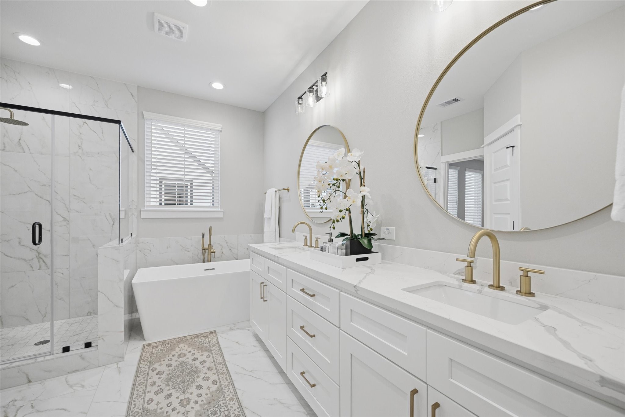 719 Thornton Road, Unit C Houston, TX 77018 - Photo 29 of 45 a spacious bathroom with double sink a mirror and a bathtub