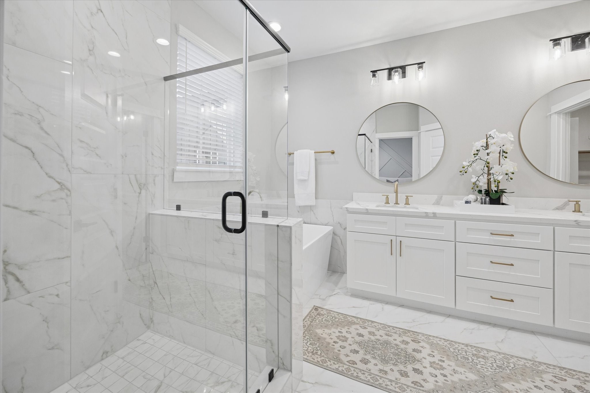 719 Thornton Road, Unit C Houston, TX 77018 - Photo 30 of 45 a bathroom with a double vanity sink and a mirror