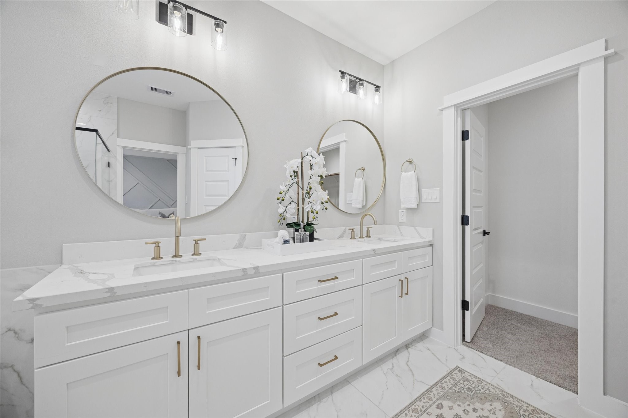 719 Thornton Road, Unit C Houston, TX 77018 - Photo 33 of 45 a bathroom with a double vanity sink and a mirror