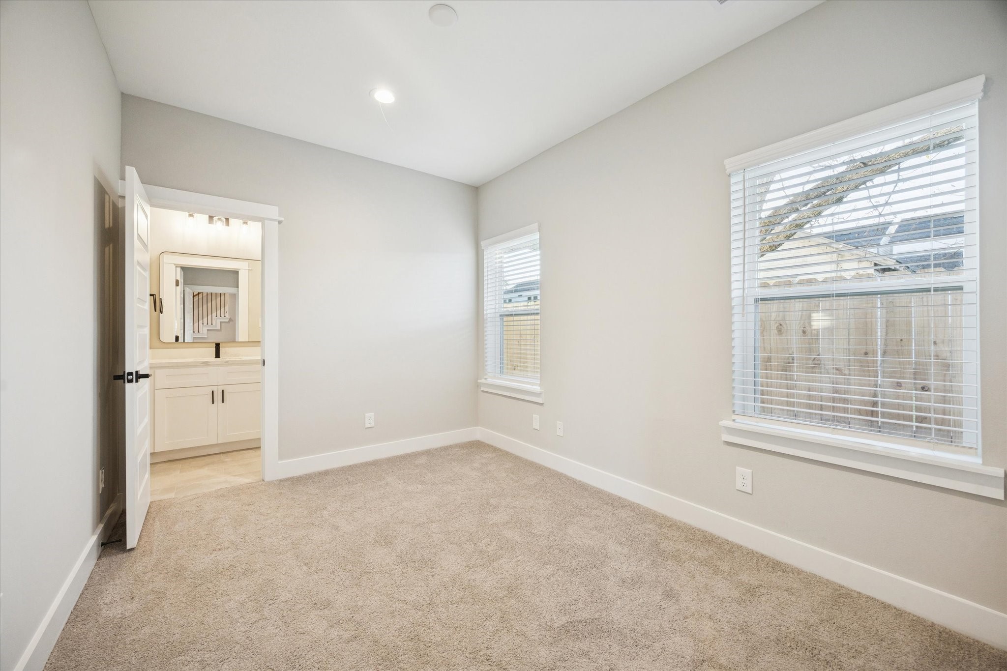719 Thornton Road, Unit C Houston, TX 77018 - Photo 40 of 45 an empty room with windows and closet