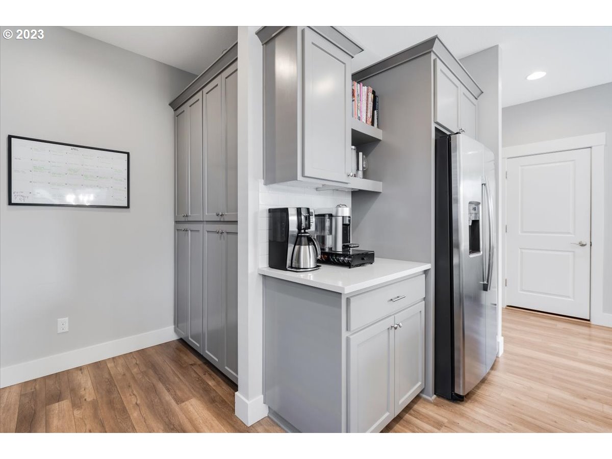2754 Northwest Inna Avenue Salem, OR 97304 - Photo 13 of 36 a kitchen with cabinets and wooden floor