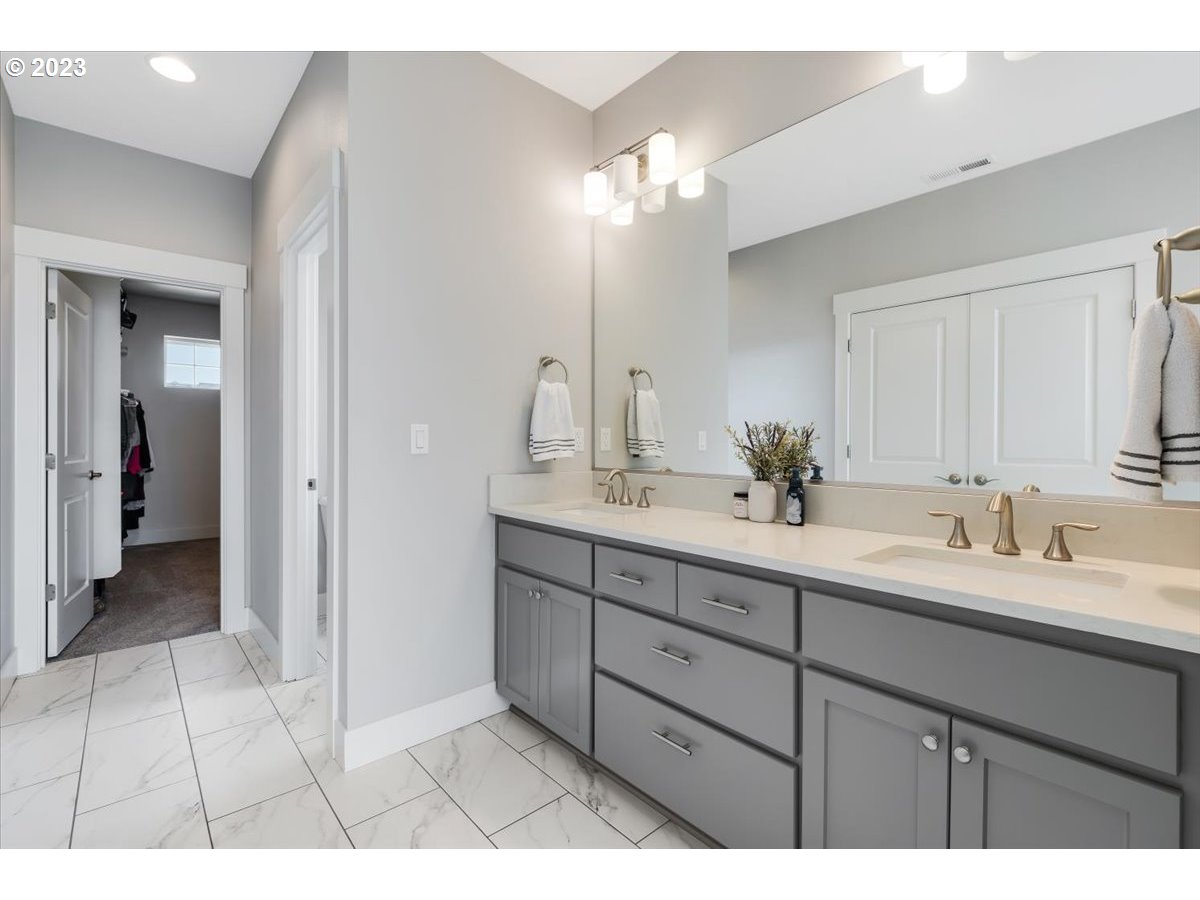 2754 Northwest Inna Avenue Salem, OR 97304 - Photo 20 of 36 a bathroom with a double vanity sink and a mirror