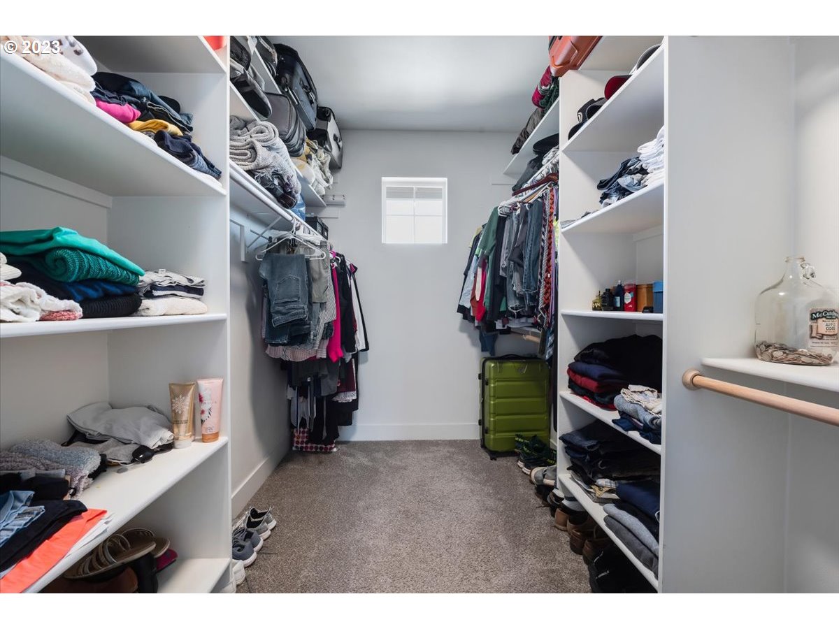 2754 Northwest Inna Avenue Salem, OR 97304 - Photo 22 of 36 a view of walk in closet with clothes and shoes
