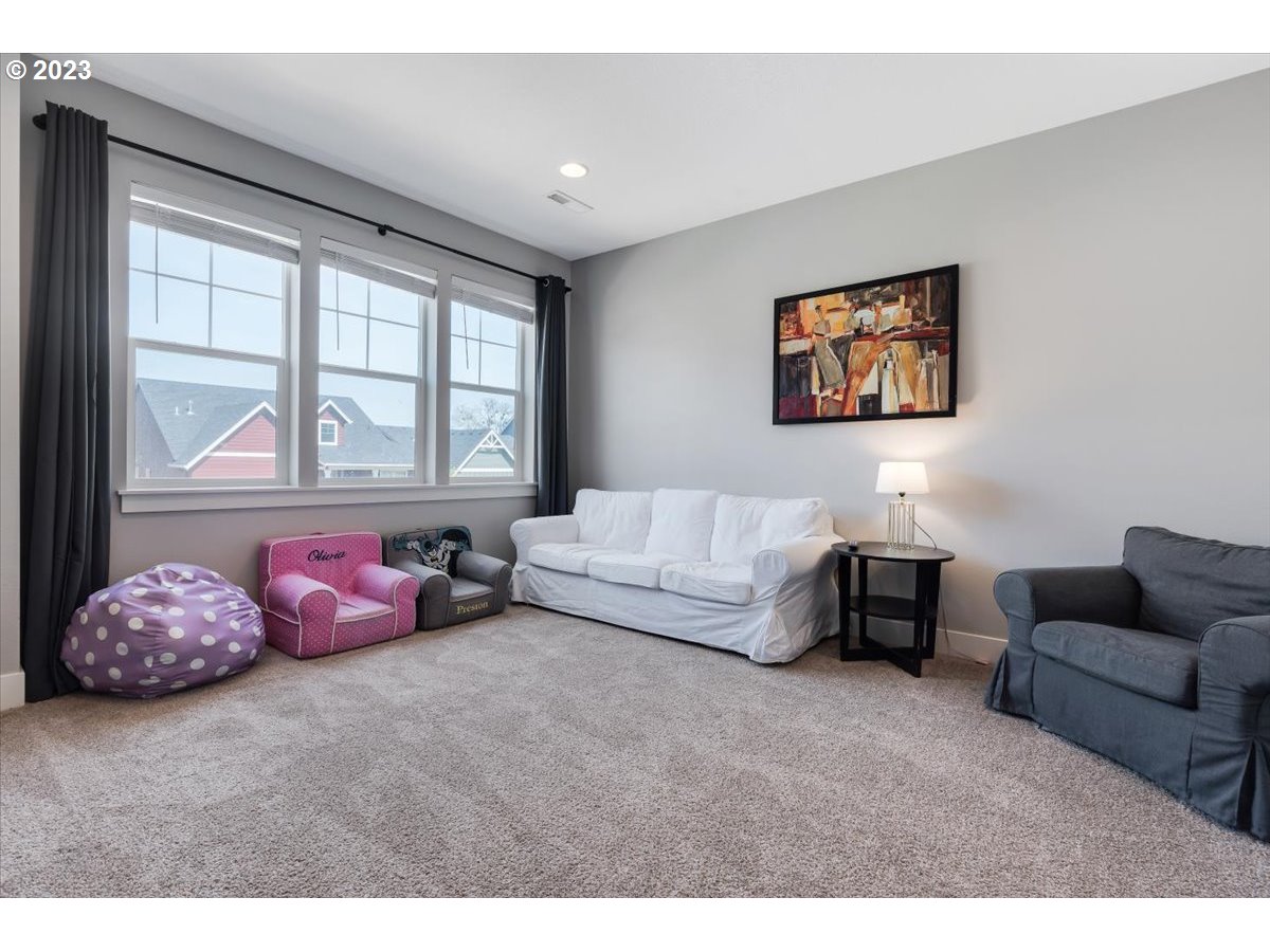 2754 Northwest Inna Avenue Salem, OR 97304 - Photo 23 of 36 a bedroom with furniture and a large window