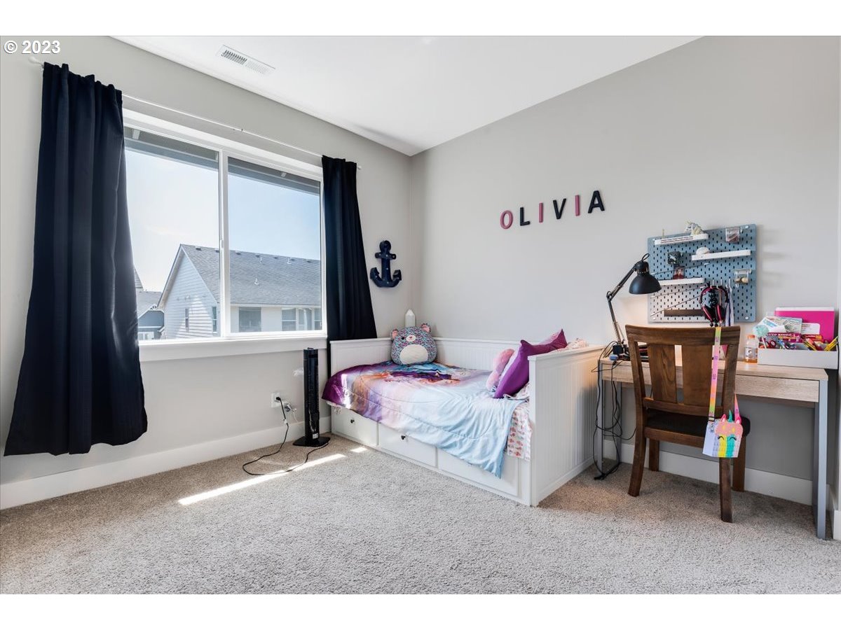 2754 Northwest Inna Avenue Salem, OR 97304 - Photo 26 of 36 a bedroom with furniture and a large window