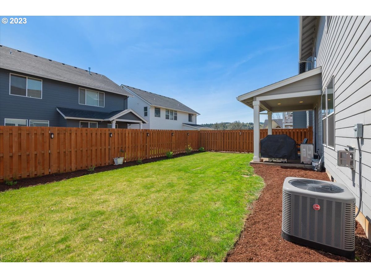 2754 Northwest Inna Avenue Salem, OR 97304 - Photo 31 of 36 a view of a backyard with wooden fence