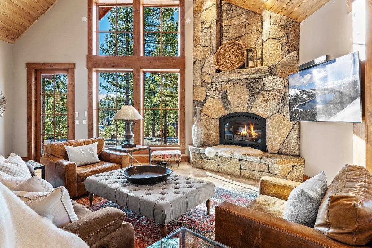 610 Joseph Bernard Truckee, CA 96161 - Photo 2 of 21 a living room with furniture a fireplace and a floor to ceiling window
