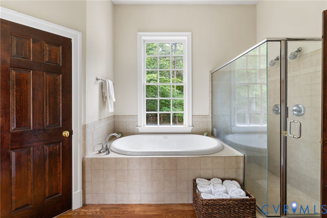 13173 Scotchtown Road Beaverdam, VA 23015 - Photo 36 of 65 a bath tub sitting in a bathroom next to a window