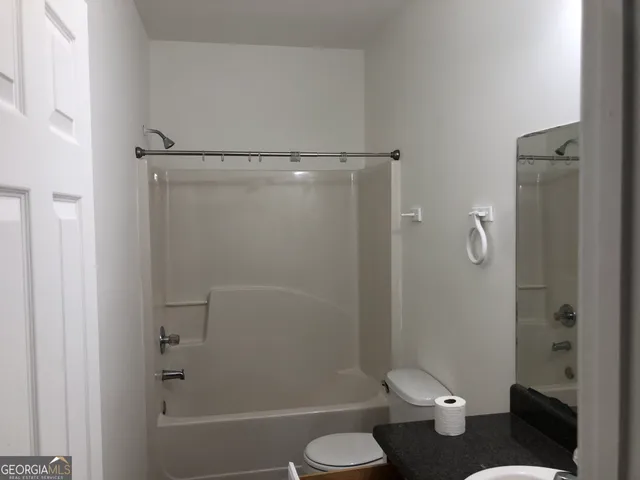a bathroom with a sink and toilet