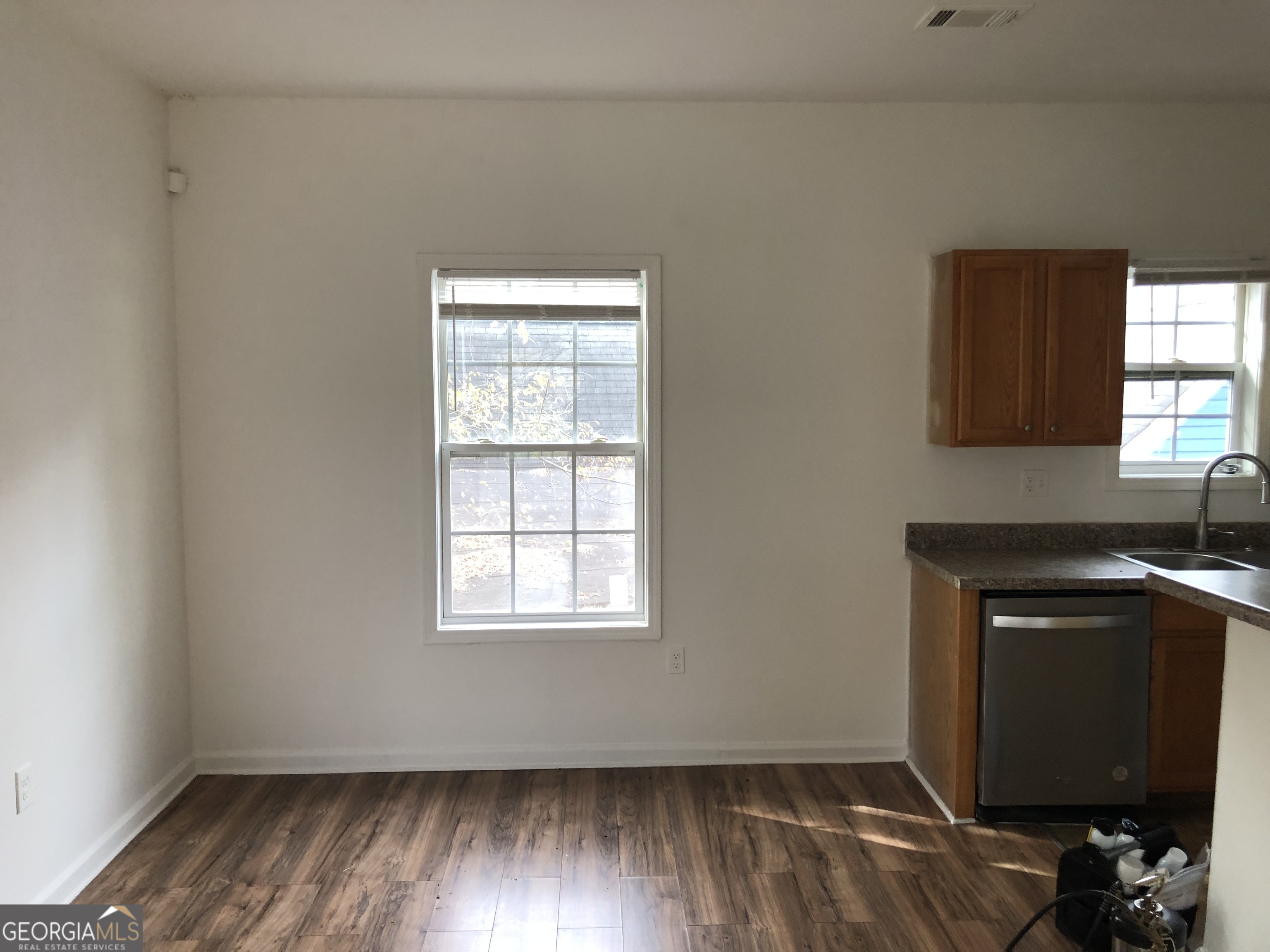 2457 Donald Lee Hollowell Parkway Northwest, Unit A Atlanta, GA 30318 - Photo 7 of 12 a view of a kitchen with wooden floor and a window