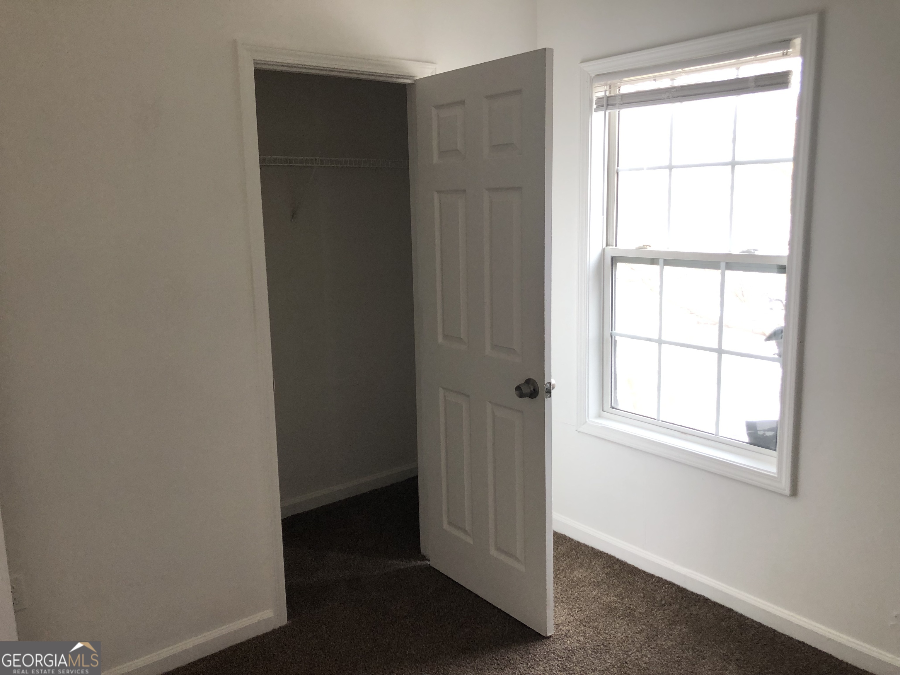 2457 Donald Lee Hollowell Parkway Northwest, Unit A Atlanta, GA 30318 - Photo 8 of 12 an empty room with a window