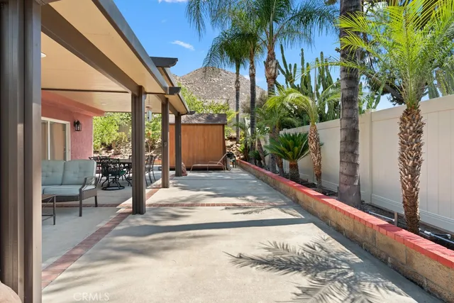 a view of a chairs and table in the patio