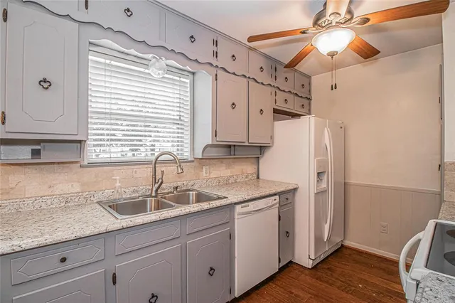 a kitchen with sink cabinets and window
