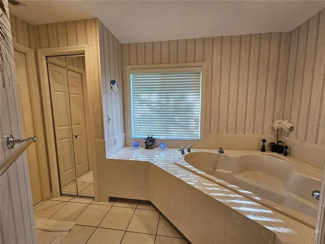 a bathroom with a bathtub and a sink