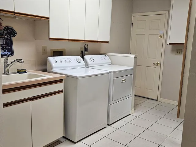 a view of a chair and table in the patio
