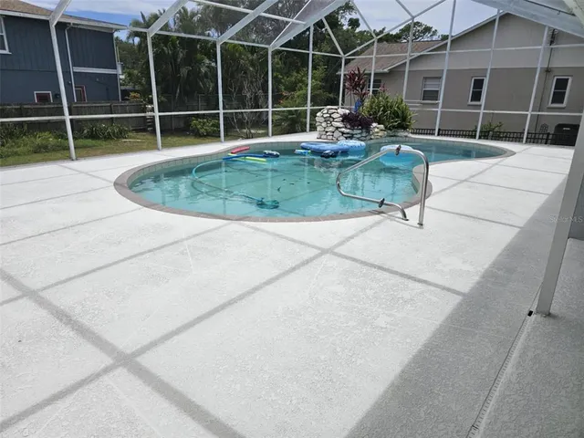 a view of a house with backyard porch and sitting area