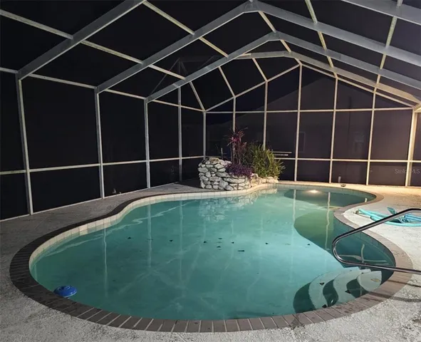 a view of a backyard with table and chairs
