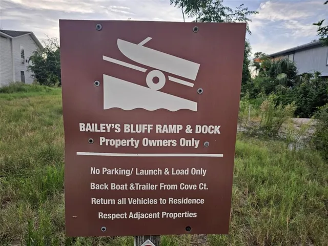 a view of a street with benches sitting next to a road