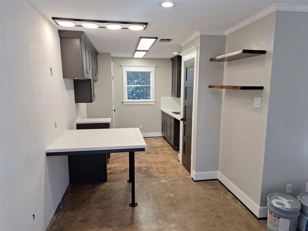 a view of a bathroom with a sink and a mirror