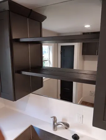 a kitchen with a refrigerator and a sink