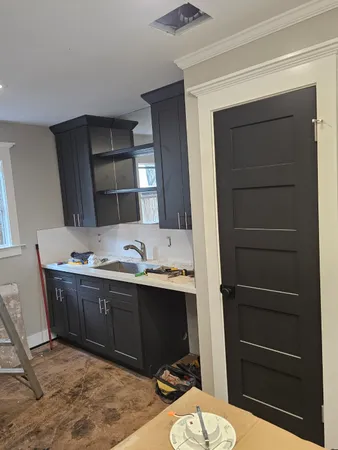 a bathroom with a sink a toilet and mirror
