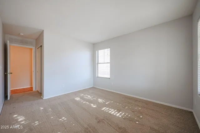 an empty room with windows